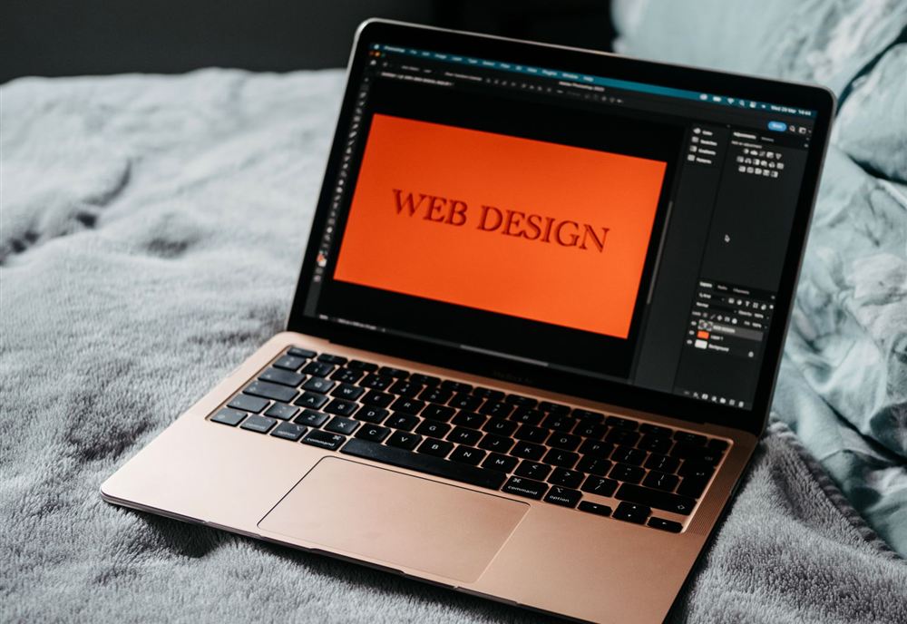 Web design project open in an editor on a laptop